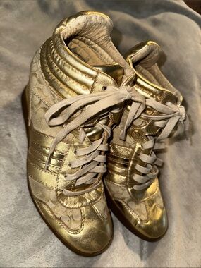 Coach Amara Gold High-Top Wedge Sneakers